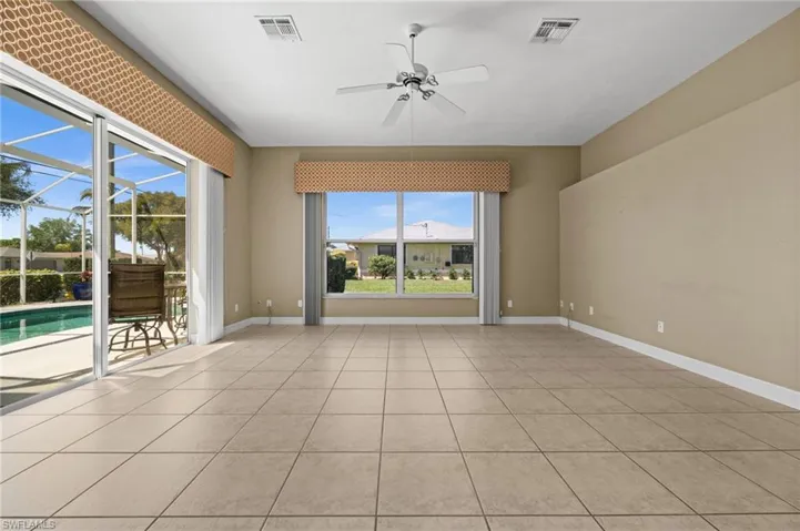 An expansive family room, also providing access to your pool and lanai.