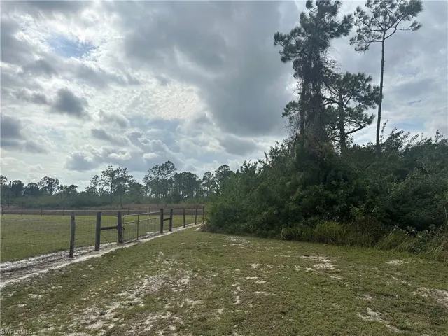 View of yard featuring fence