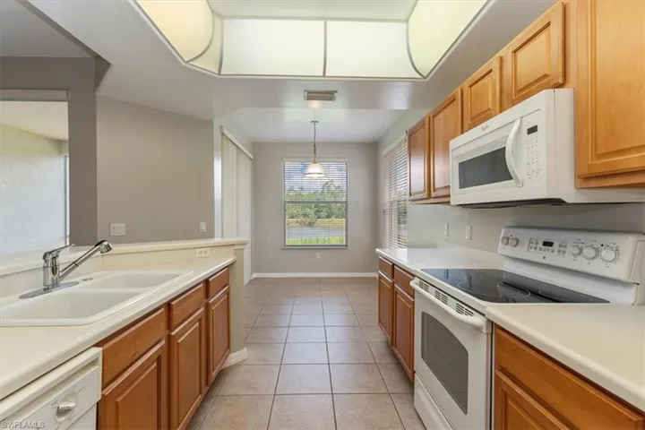 Kitchen looking into Breakfast Area