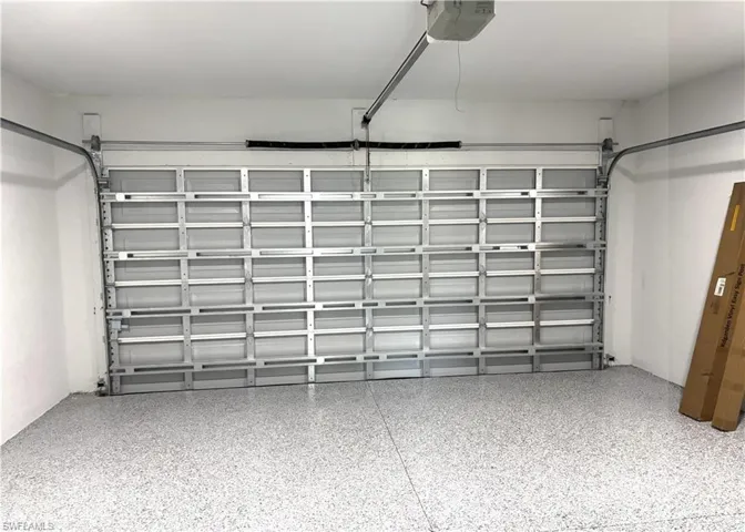 Garage featuring a garage door opener
