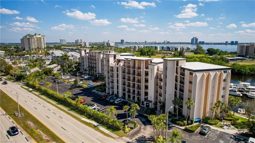 View of urban area with apartment complex / building and a large body of water