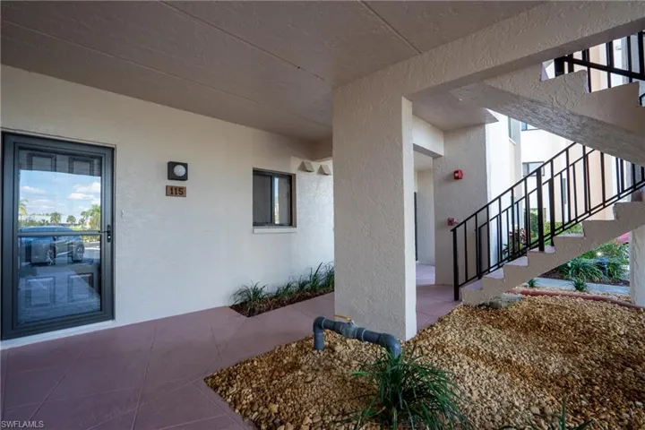Property entrance with stucco siding