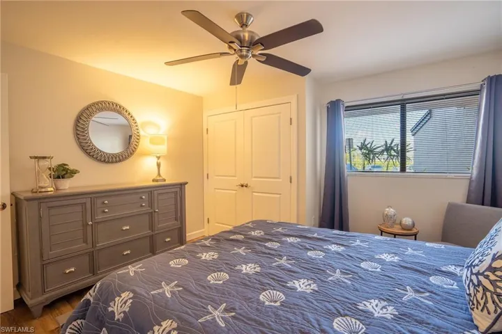 Bedroom with a ceiling fan and wood finished floors