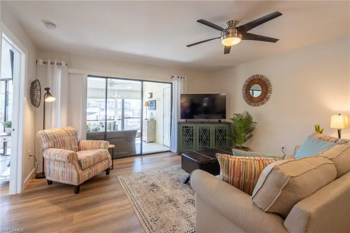 Living room featuring wood finished floors and ceiling fan