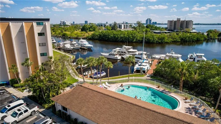 View of urban area with numerous boat docks and a nearby body of water