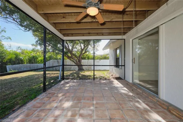 Unfurnished sunroom featuring beamed ceiling and wooden ceiling