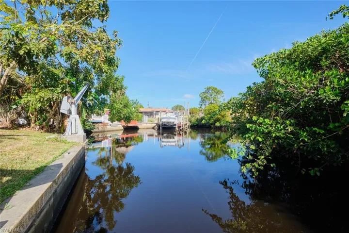 Property view of water with a dock