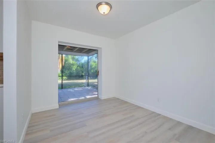 Unfurnished room with light hardwood / wood-style flooring