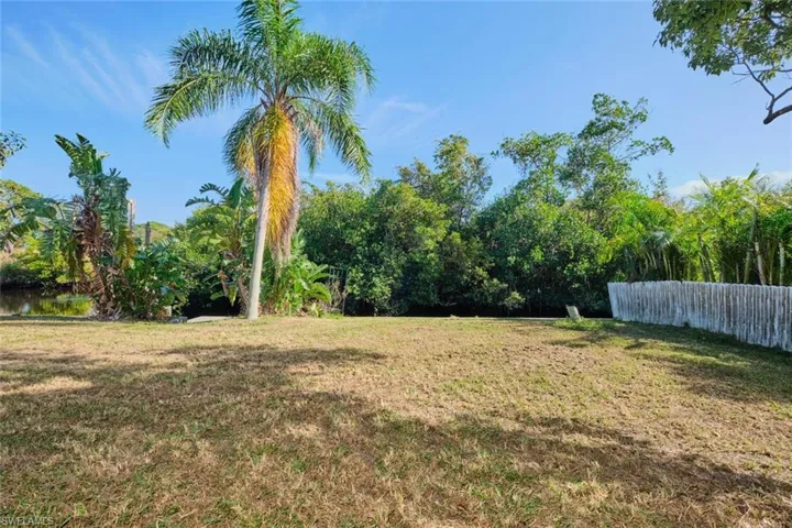 View of yard with a water view