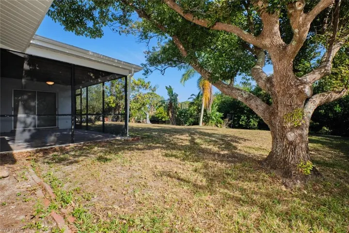 View of yard with a sunroom