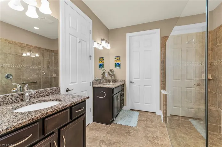 Master Bath with Dual Sinks, Water Closet, Oversized Glass Shower Without a Door, Leading To Very Large Master Closet