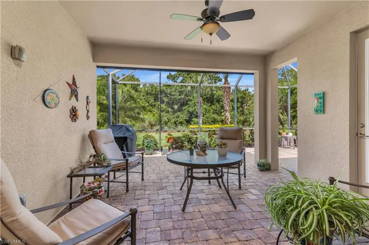 Extended Lanai With Beautiful Private Preserve Views, Generous Under-Truss Area For Shaded Enjoyment. Electric Storm Shutter (not seen) Provides Additional Protection And Keeps The Lanai Cooler In The Late Afternoon.