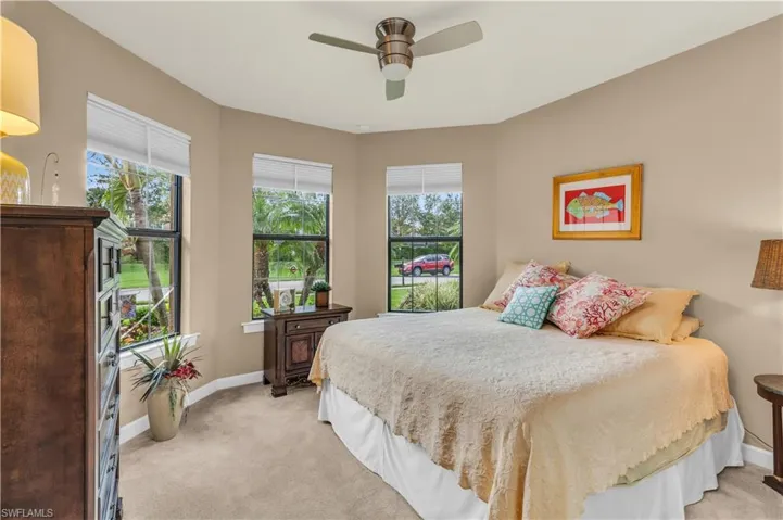 Guest Bedroom With Beautiful Windows And Newer Carpet. Ample Space For A King-Sized Bed
