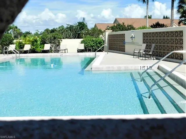 Community pool featuring a patio area