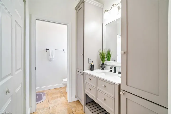 Bathroom featuring vanity and light tile patterned floors