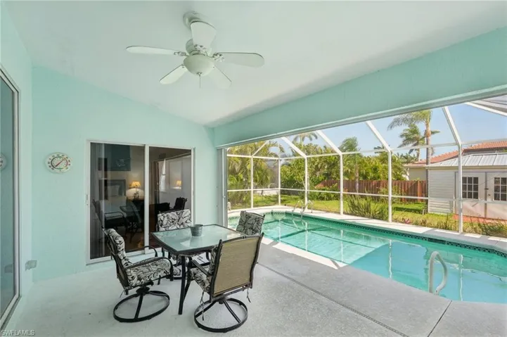 View of pool featuring a fenced in pool, a ceiling fan, a patio area, and fence