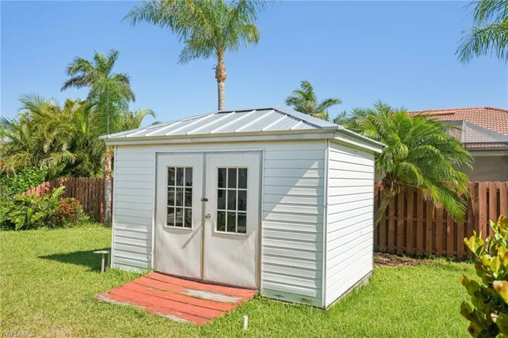 View of shed with fence