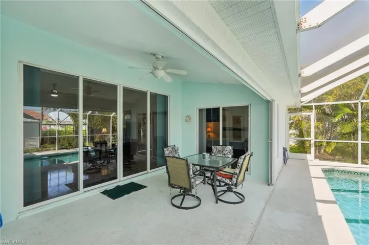 Sunroom featuring a ceiling fan
