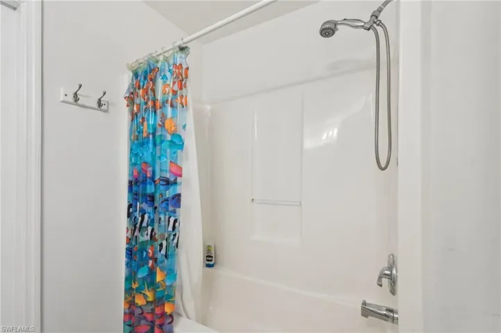 Full bath featuring shower / tub combo