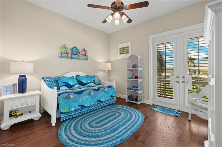 Guest Bedroom with French doors to the balcony