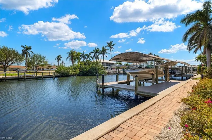 Dock area with boat lift on the canal.