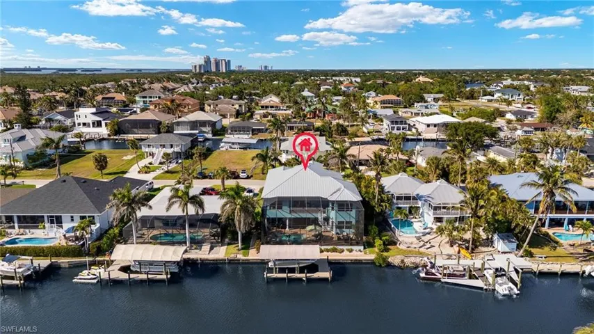 Birds eye view of property featuring a Canal view and a residential view