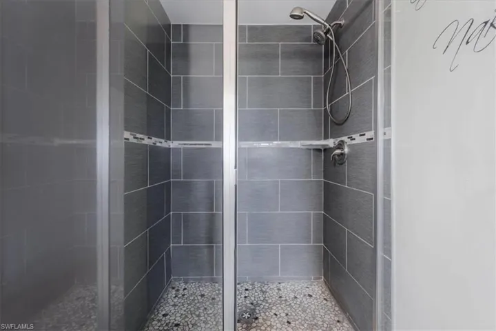 Bathroom with a shower with shower door