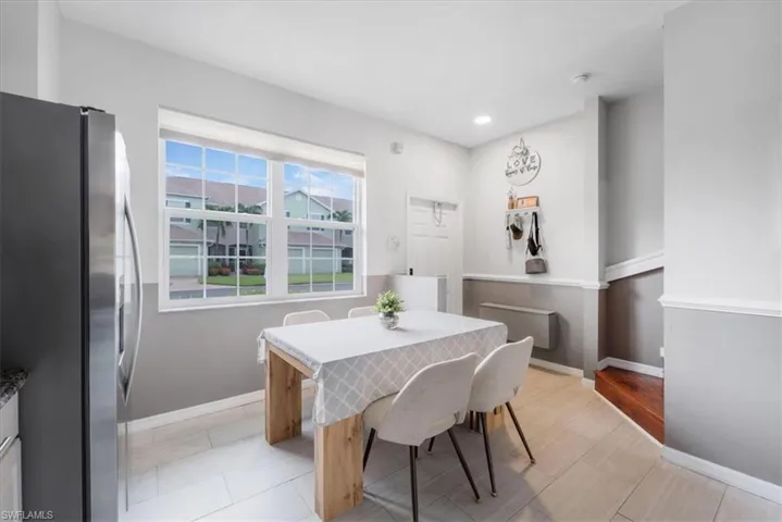 Dining room with light hardwood / wood-style flooring