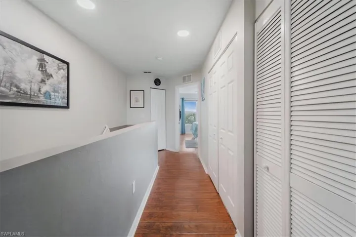 Hallway with wood-type flooring