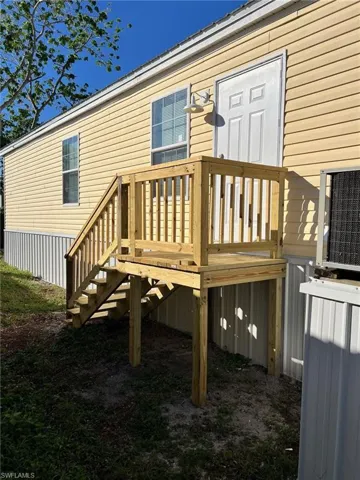Back of property with a deck