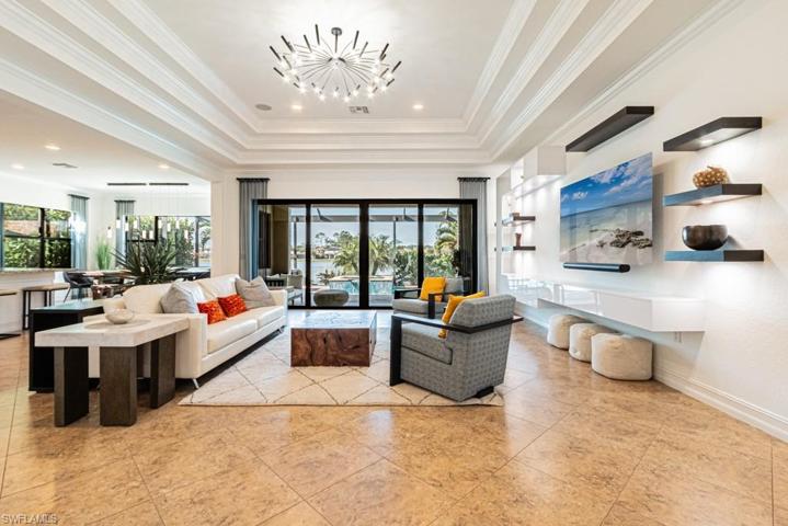 Beautiful Living Room with custom built-in shelving with lighting