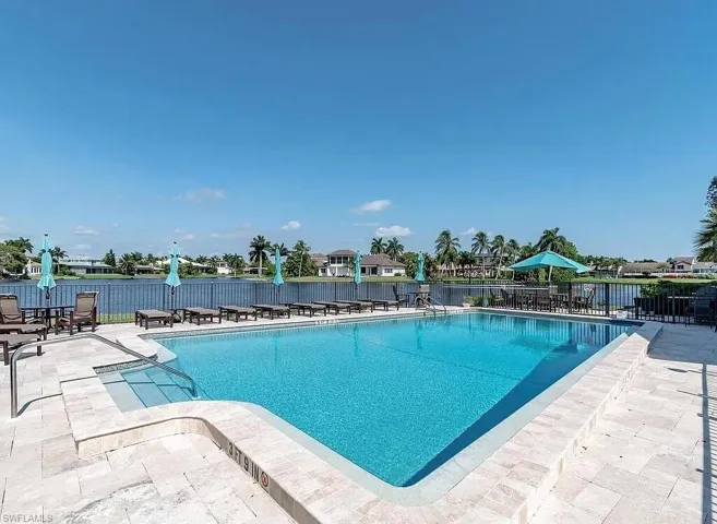 Community pool with a patio area