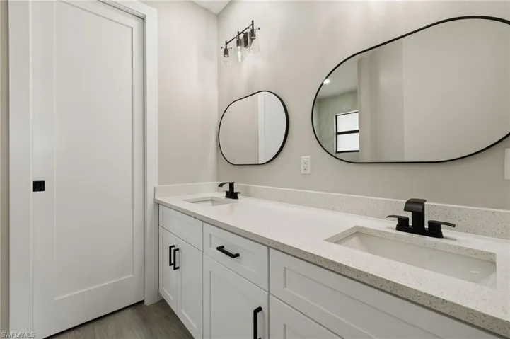 Bathroom featuring wood-type flooring and vanity