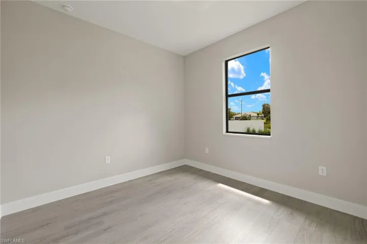 Spare room with light hardwood / wood-style flooring