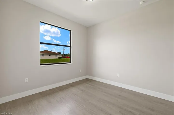 Empty room with light wood-type flooring