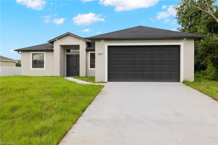 View of front of house with a front yard