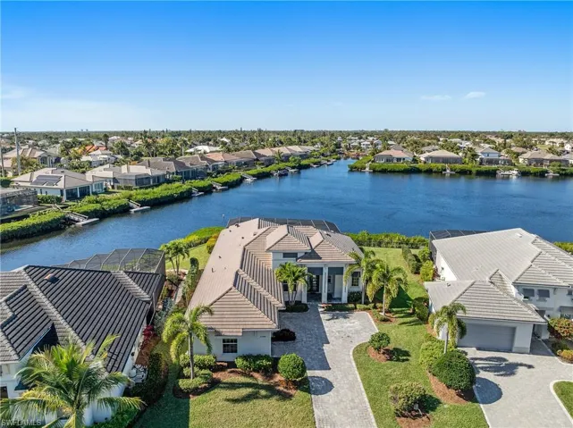 Aerial view of residential area with a nearby body of water