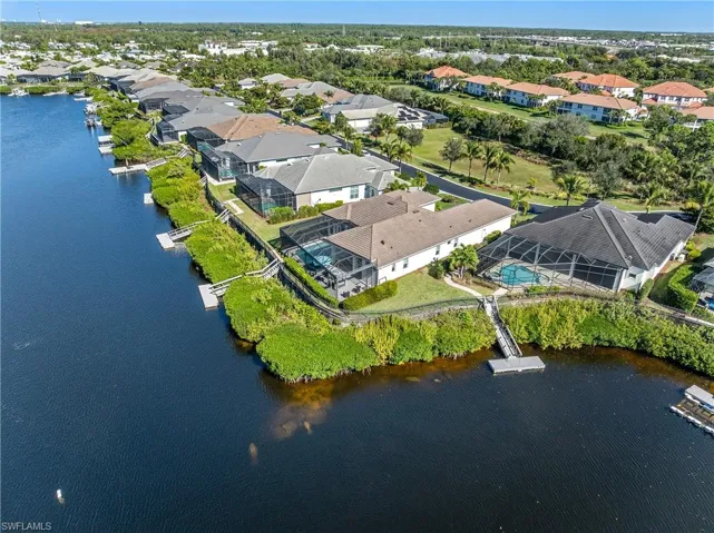 View of property location featuring nearby suburban area and a nearby body of water