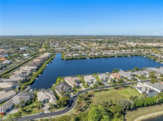 View of property location with nearby suburban area and a large body of water