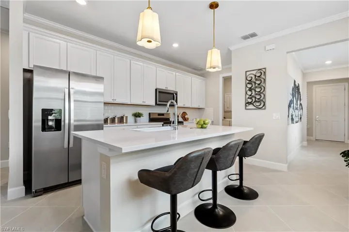 Gourmet kitchen with quartz counters and upgraded cabinetry