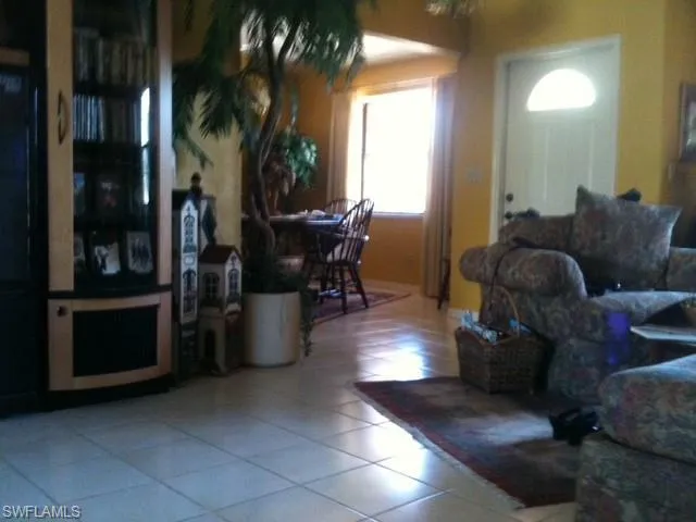 Living area featuring tile patterned flooring