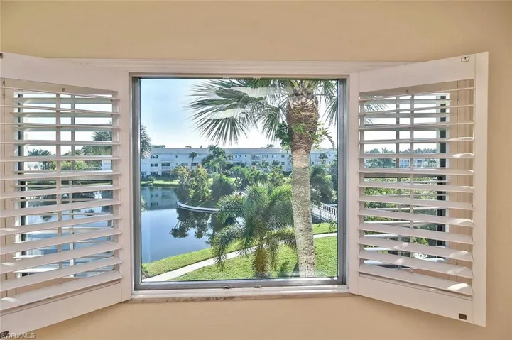 Entryway with a water view and healthy amount of natural light