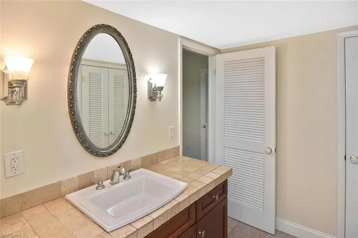 Bathroom with vanity and baseboards