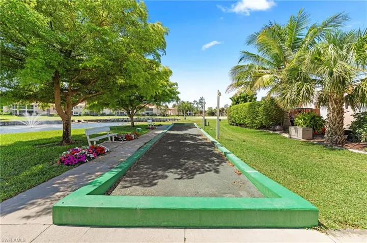 Bocce ball court featuring a concrete perimeter and dark playing surface