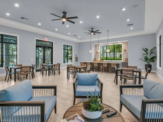 Living room with light wood-type flooring and ceiling fan