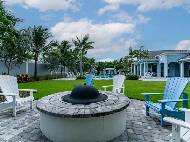 View of patio / terrace with a fire pit and a pool