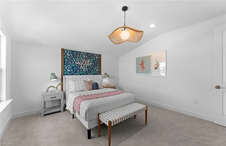 Bedroom featuring carpet, lofted ceiling, and recessed lighting