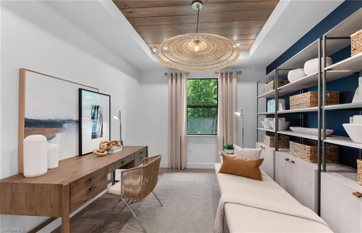 Office area with a wooden tray ceiling