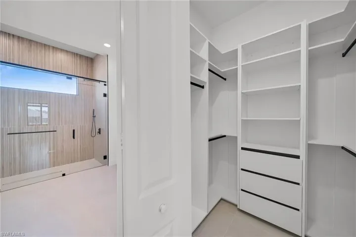 Walk in closet featuring light tile patterned floors
