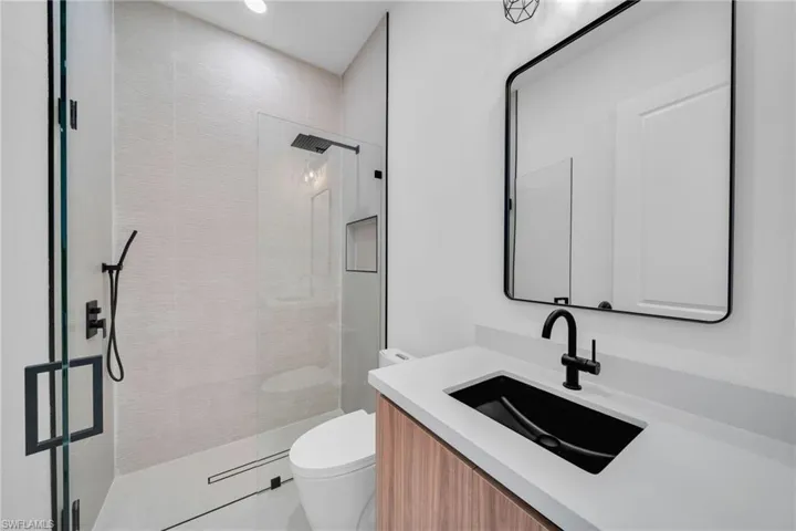 Full bathroom with vanity and a walk in shower